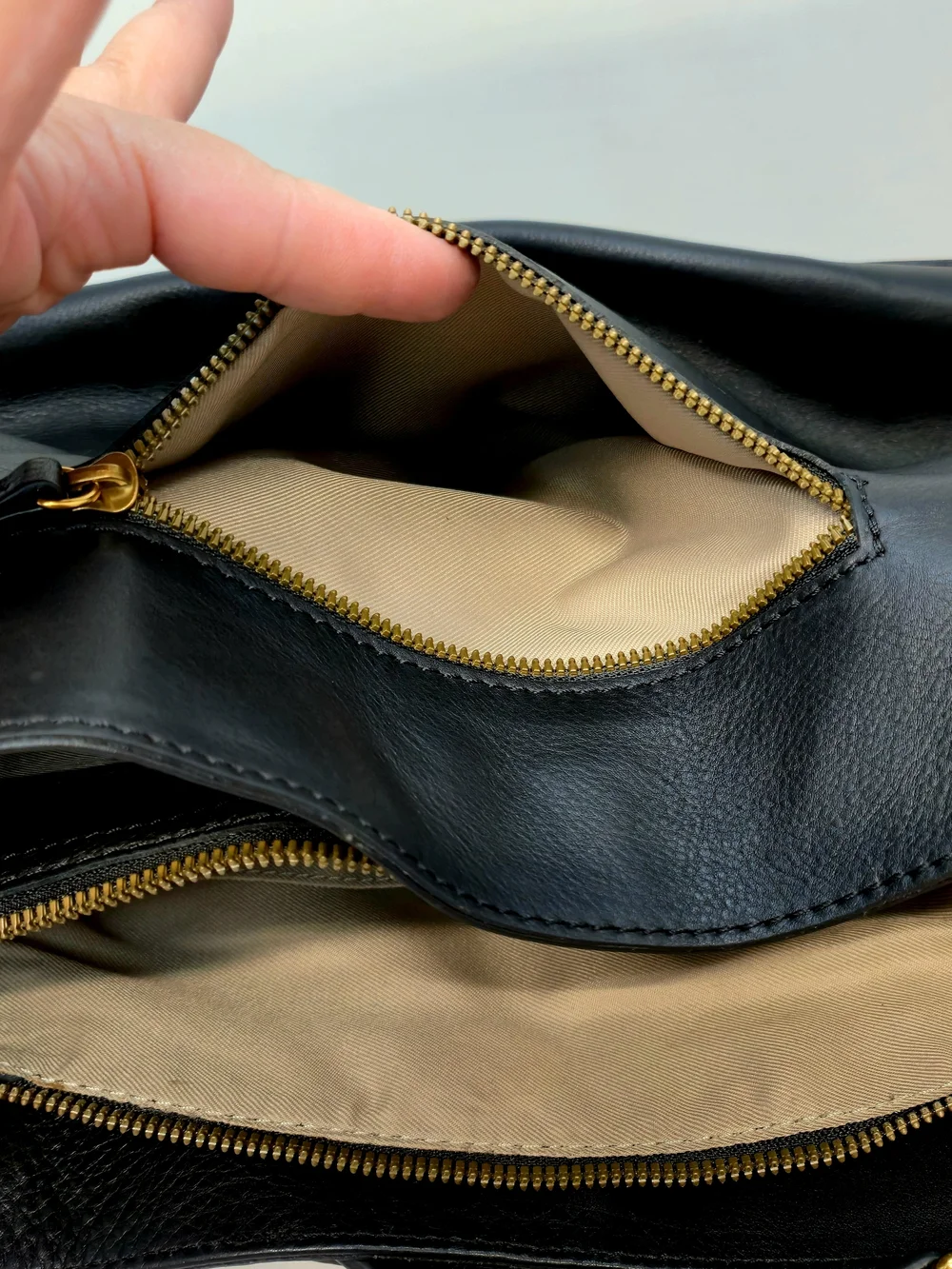 Elegant Black Leather Shoulder Bag with Gold Stud Details
